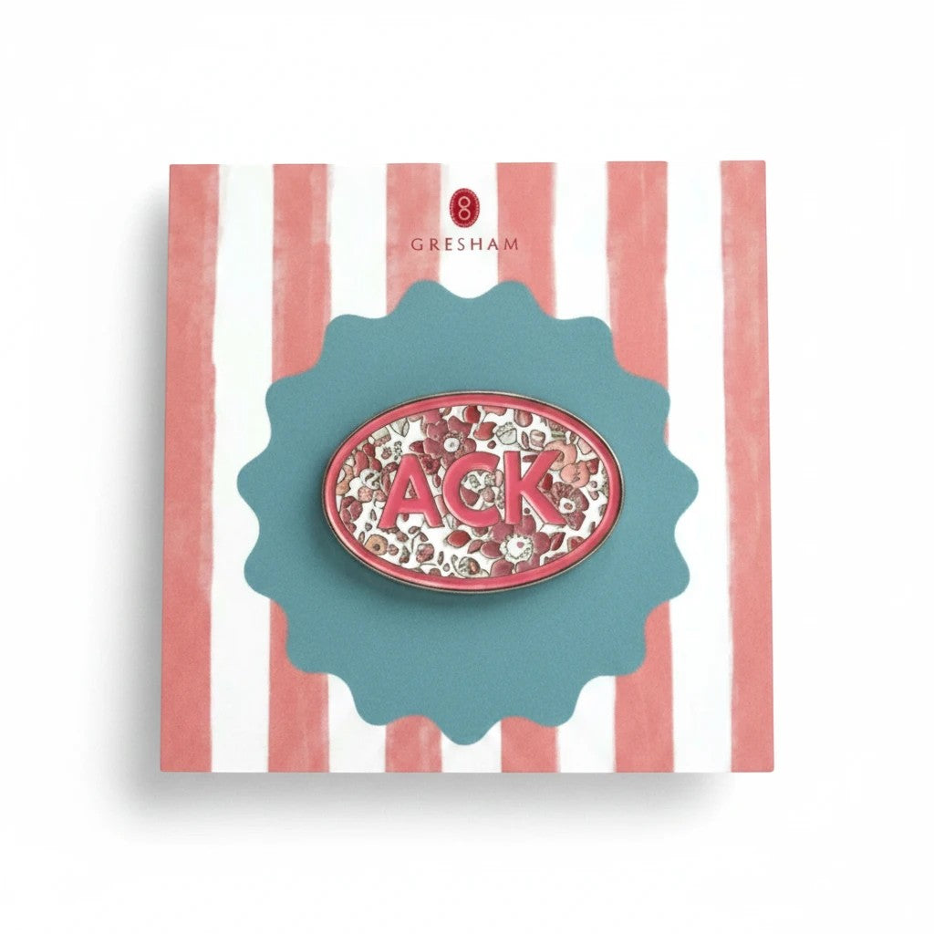 Floral ACK needle minder on a striped display card