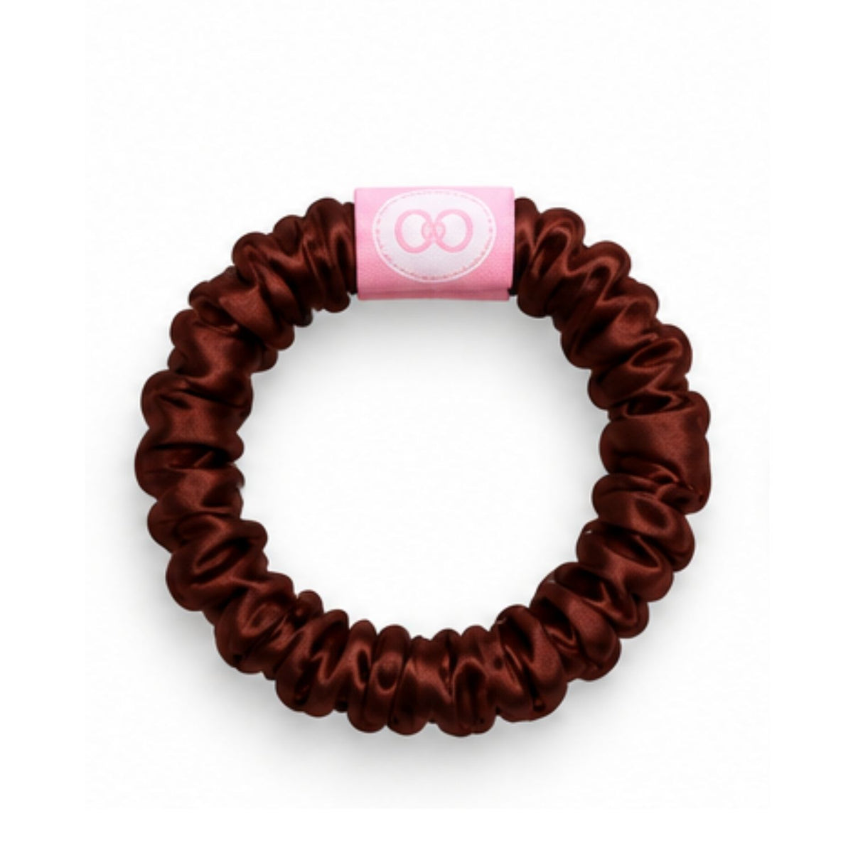 Chocolate brown scrunchie with a pink logo tab
