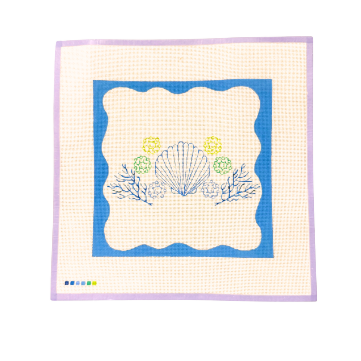 Shell Pillow needlepoint canvas with a blue border and pastel shell design