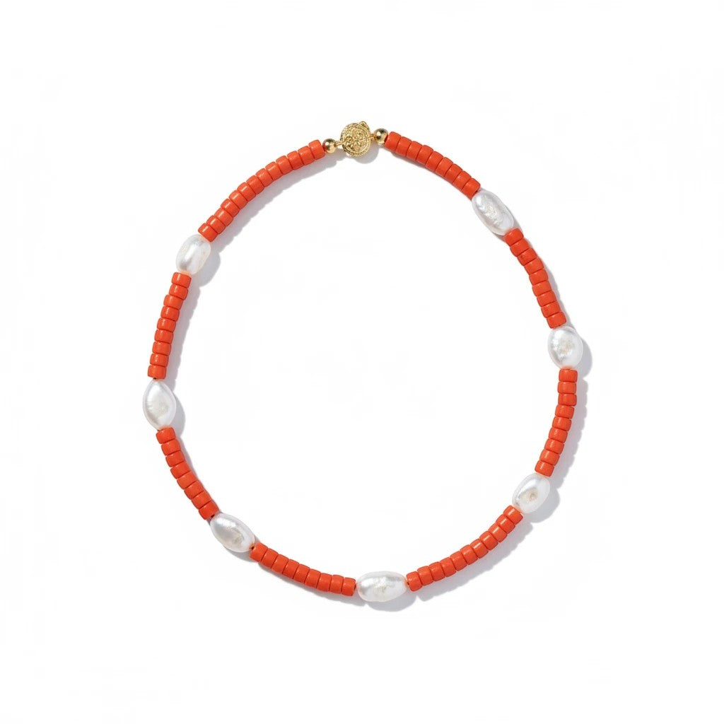 Coral colored Perugia necklace with white pearl accents
