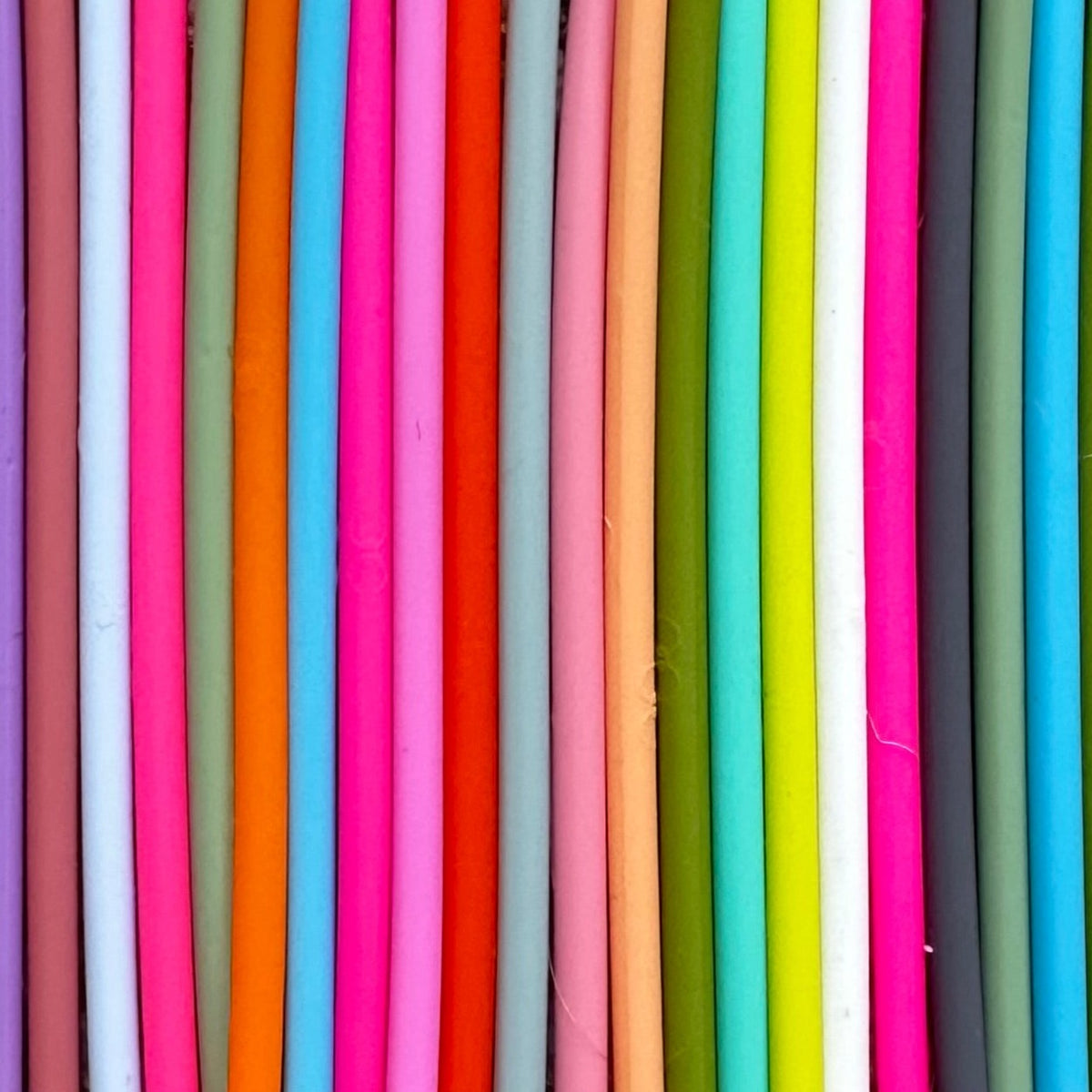 Silicone bracelet bands lined up in a range of bright colors