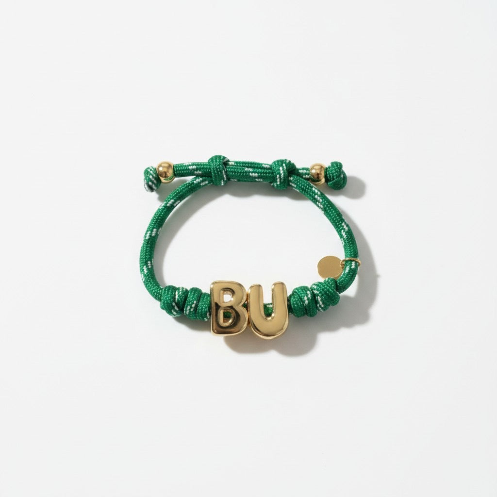 Green paracord bracelet with gold BU letters
