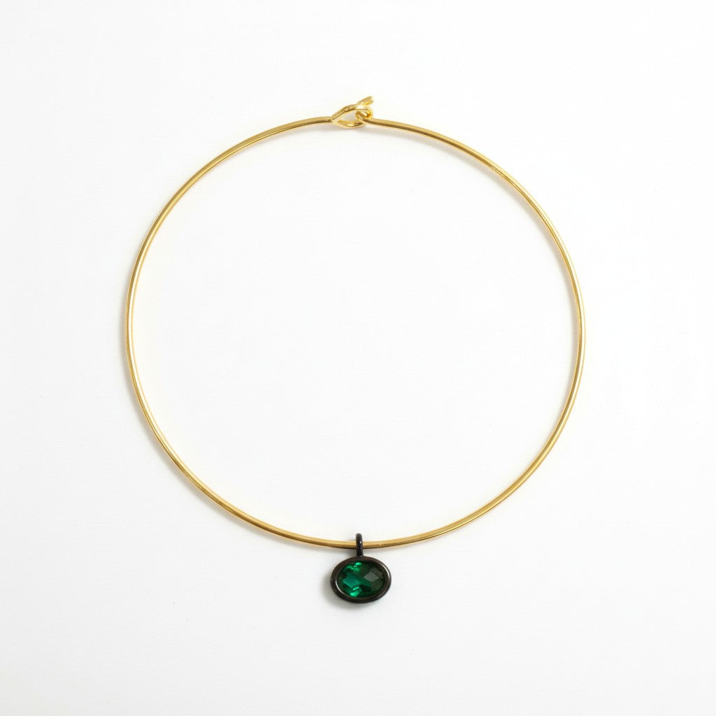 Gold Mida collar with a dark green Bolla charm