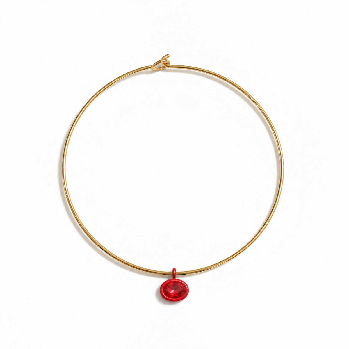 Gold Mida collar with a bright red Bolla charm