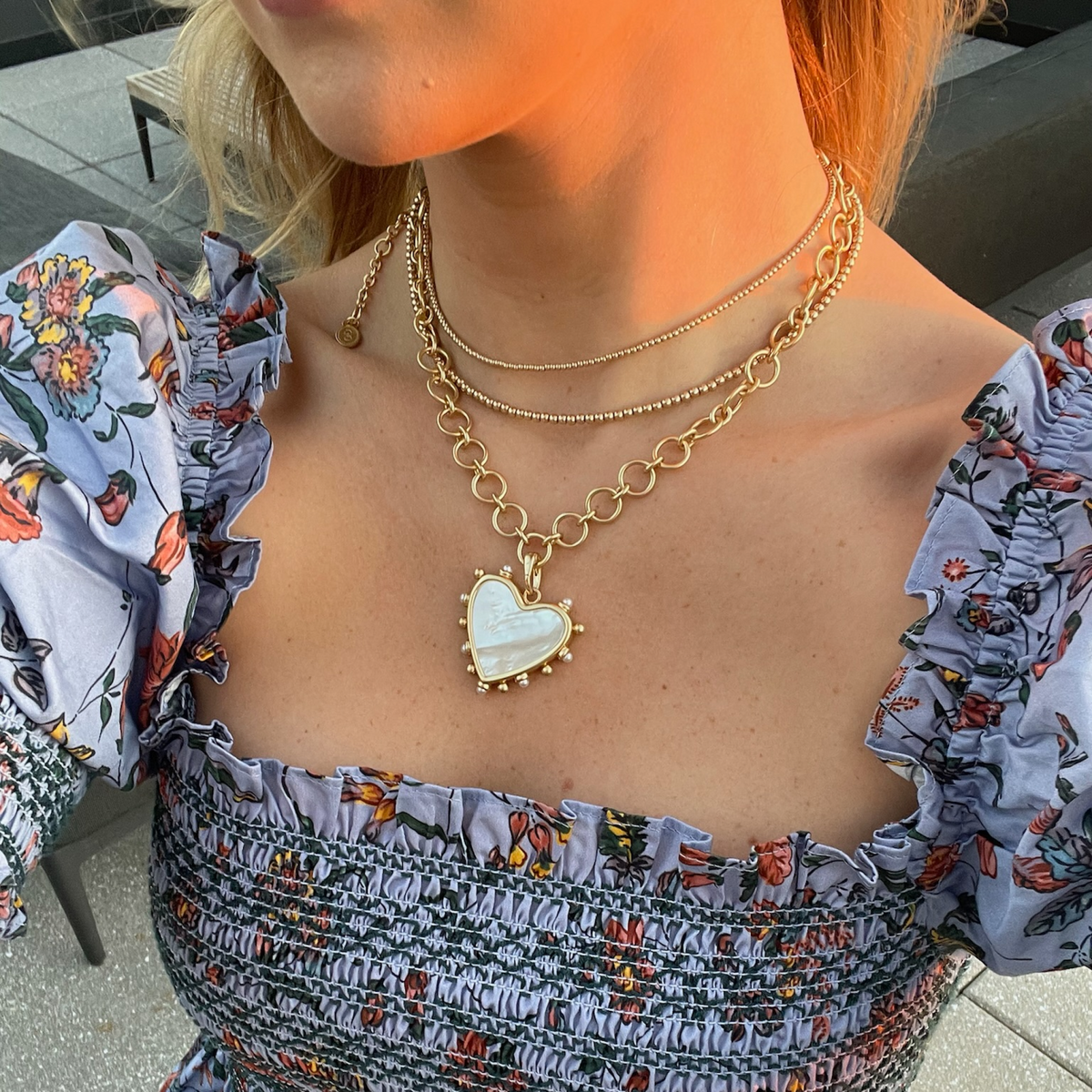 Woman wearing Custom Charm Catena Necklace by Gresham Jewelry