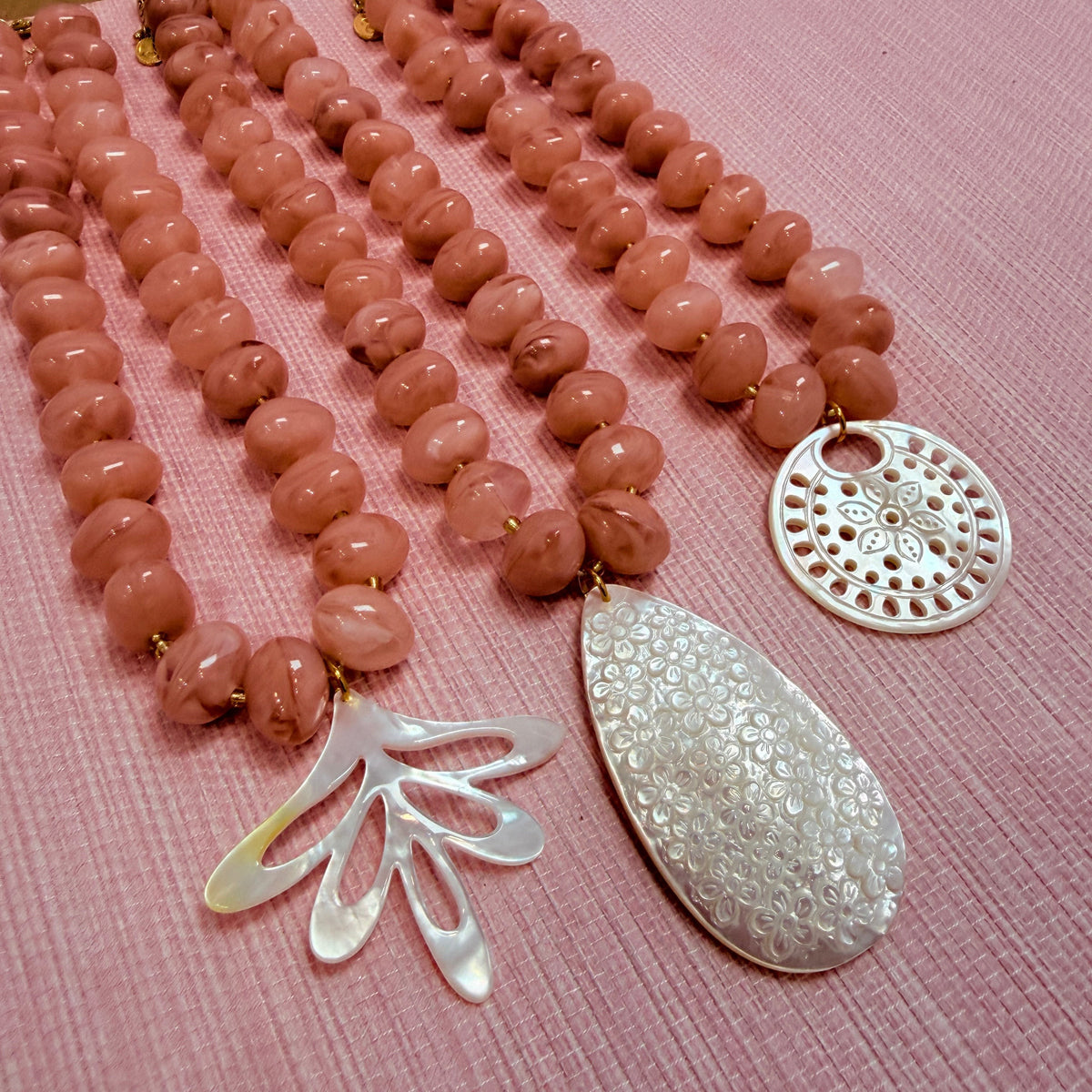 Pink Nardo necklaces with three pendant shapes
