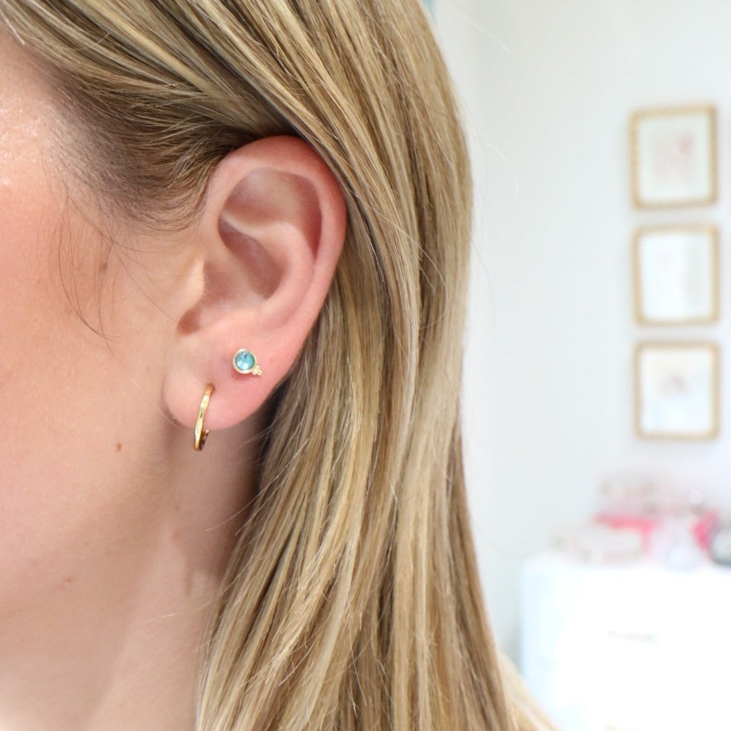 Woman wearing Fortuna Studs by Gresham Jewelry