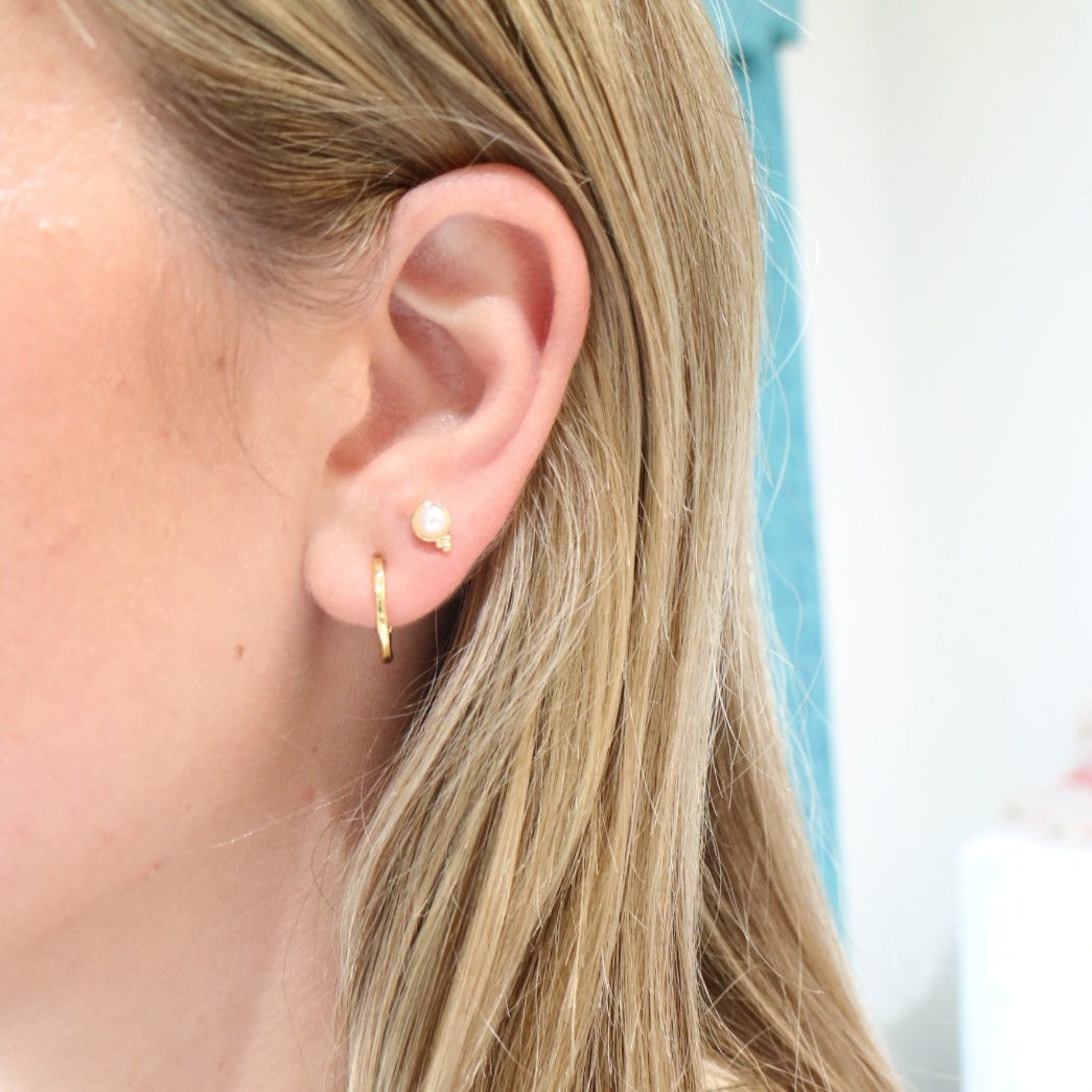Woman wearing Fortuna Studs by Gresham Jewelry