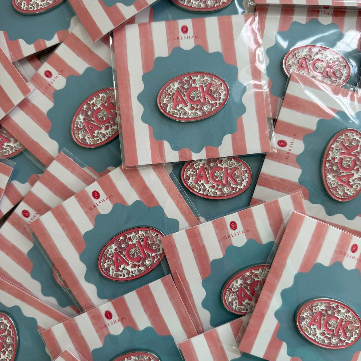 Floral ACK needle minders on striped cards