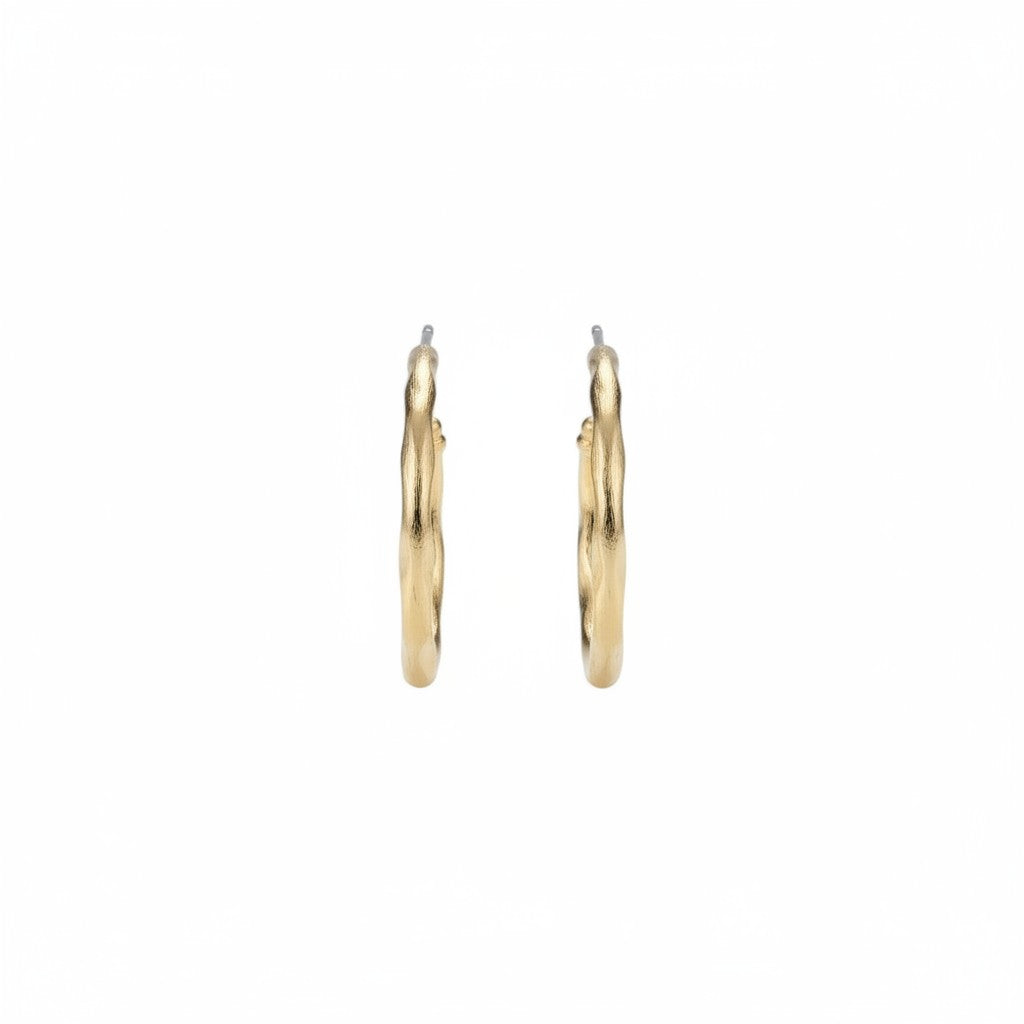 Medium gold Mia hoop earrings shown from the side