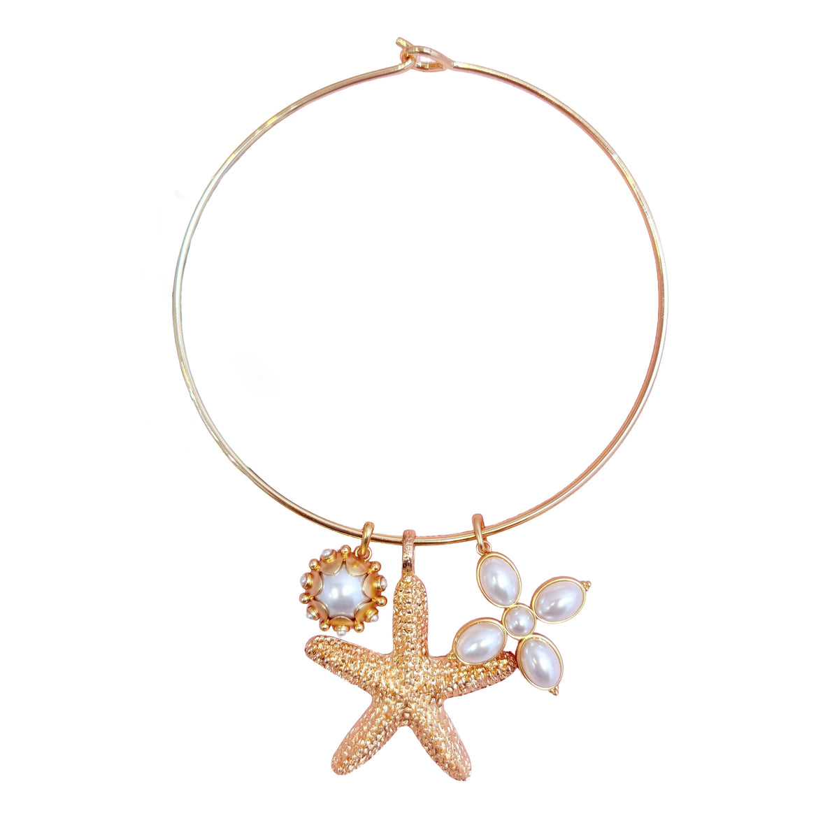 Gold Mida collar styled with several charms