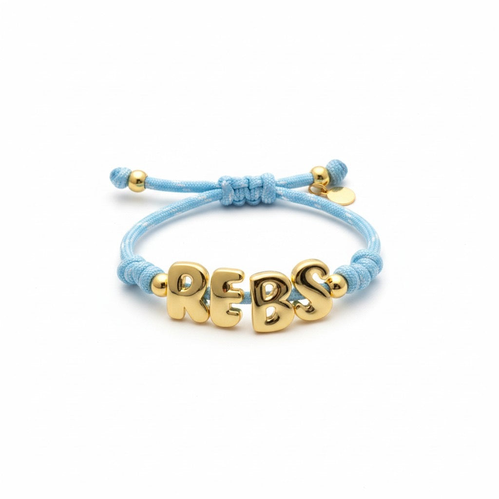 Powder blue paracord bracelet with gold REBS letters