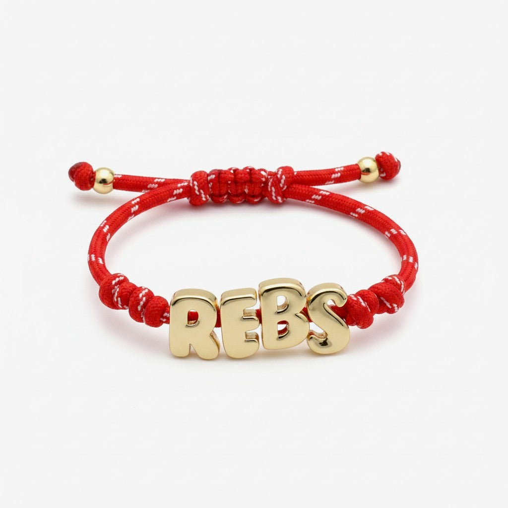 Red paracord bracelet with gold REBS letters