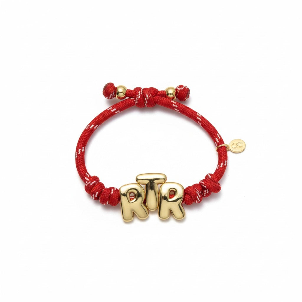 Red paracord bracelet with gold RTR letters
