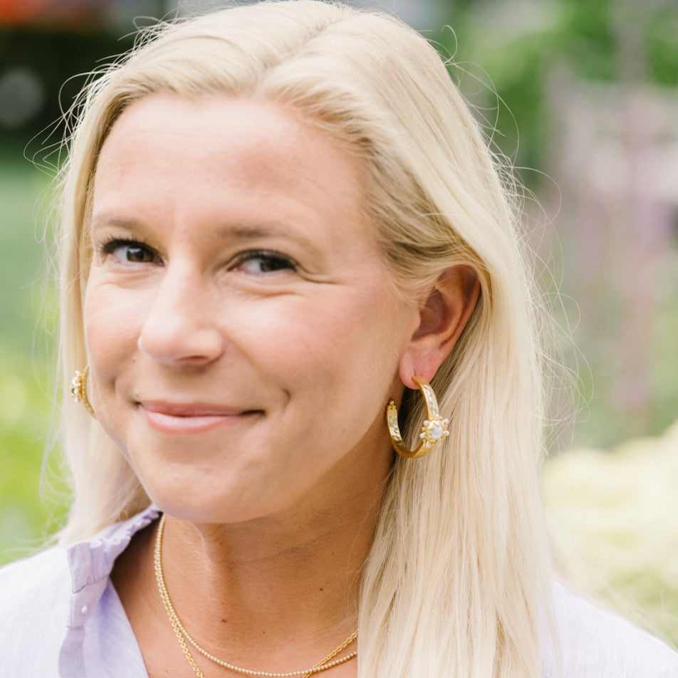 Woman wearing Perla Hoops by Gresham Jewelry
