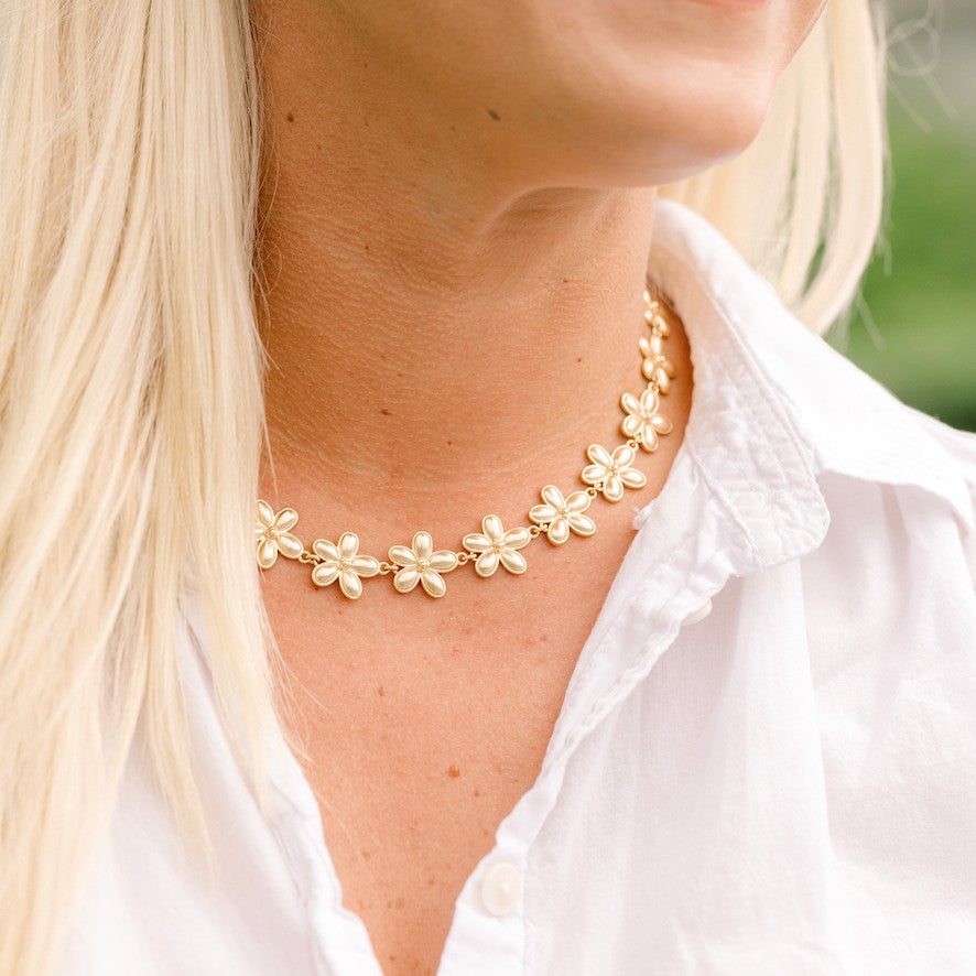 Woman wearing Flora Necklace - Gold by Gresham Jewelry