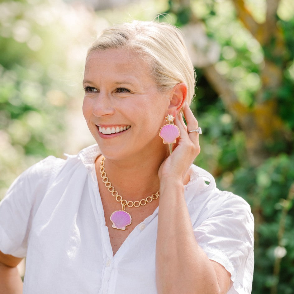 Woman wearing Peregrina Shell Earrings by Gresham Jewelry