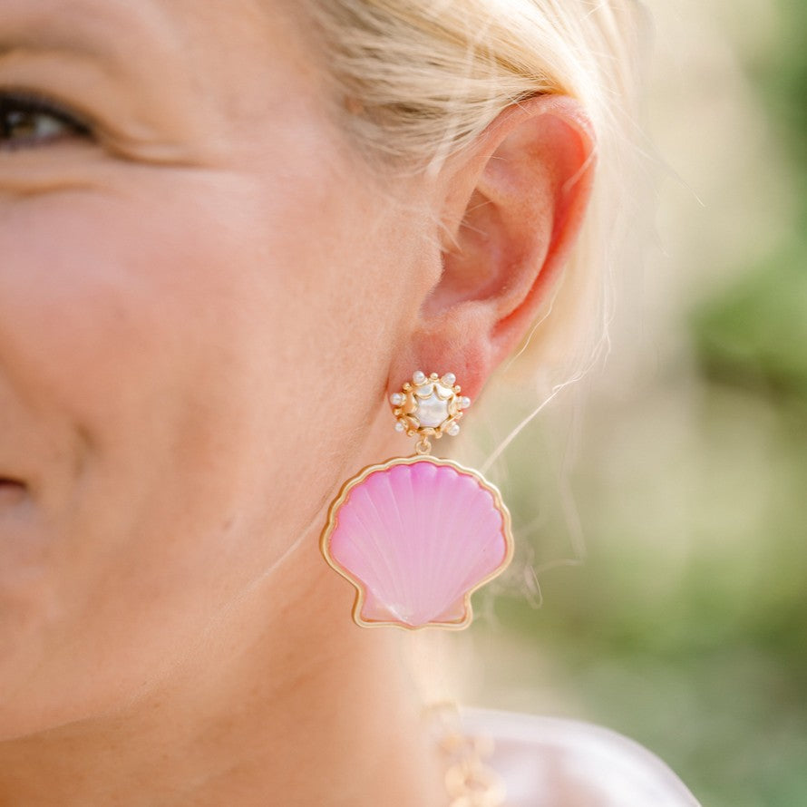 Woman wearing Peregrina Shell Earrings by Gresham Jewelry