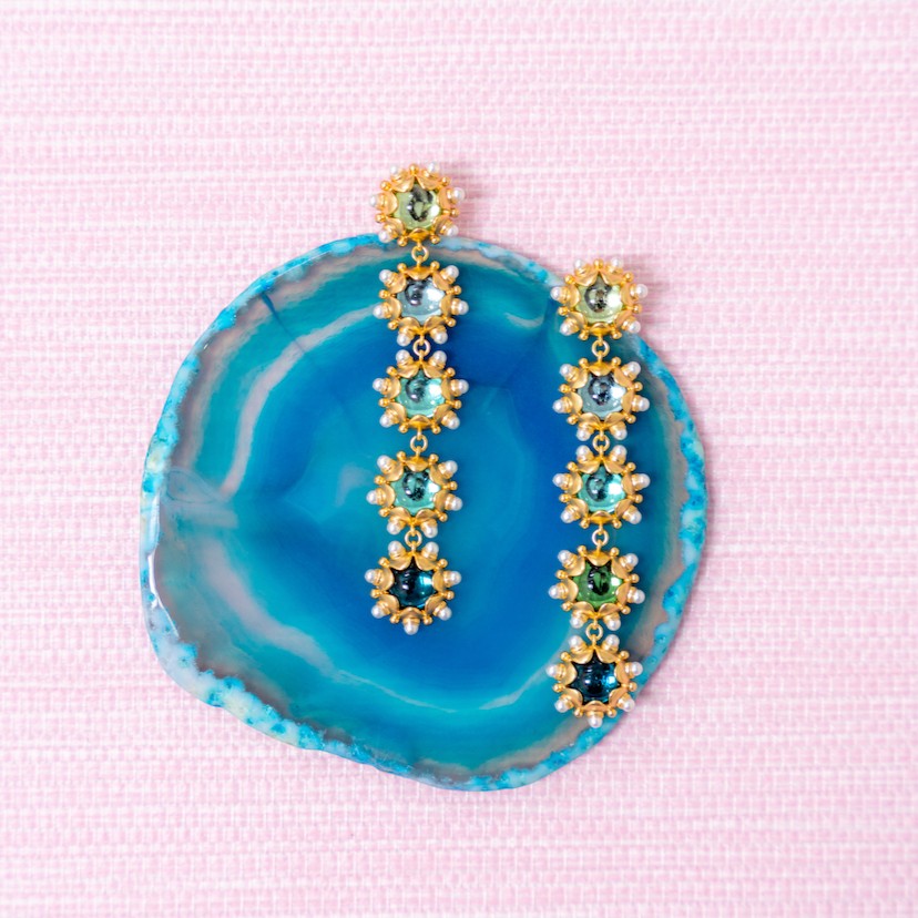 Aqua ombre Perla drop earrings on a blue agate slice