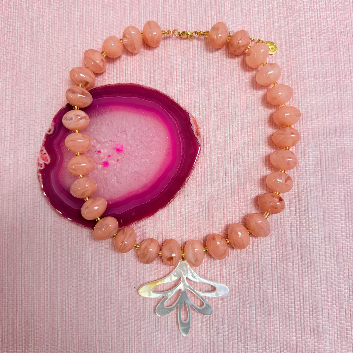 Pink Nardo necklace with a fan shaped pendant