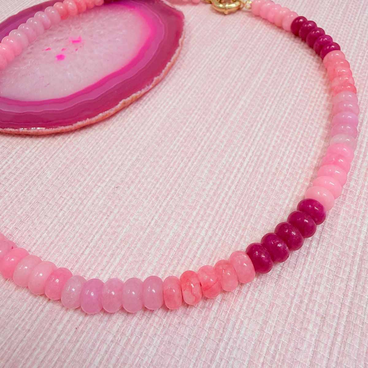 Close-up of pink and magenta beads on the Amalfi necklace