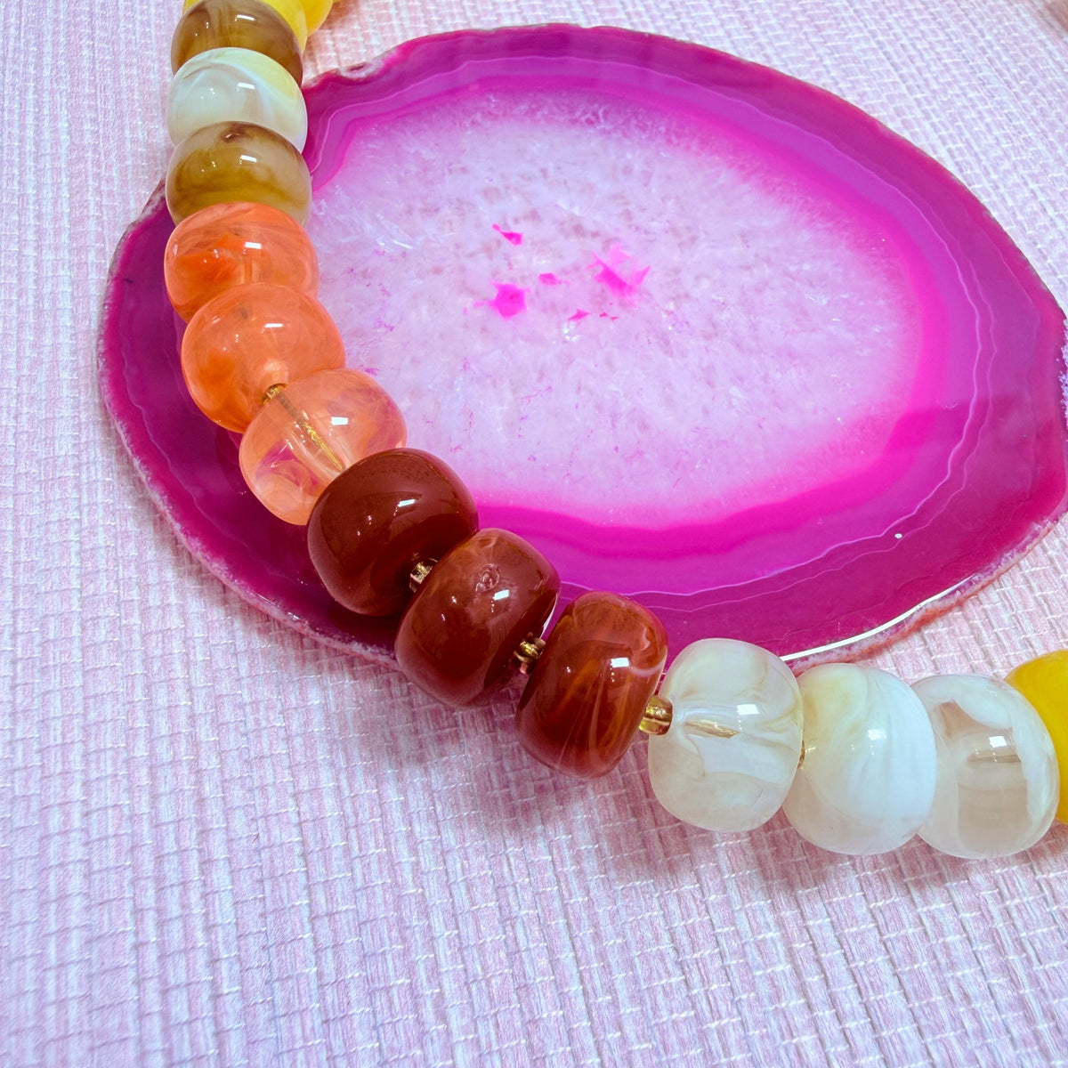 Close-up of sunset colored Nardo resin beads