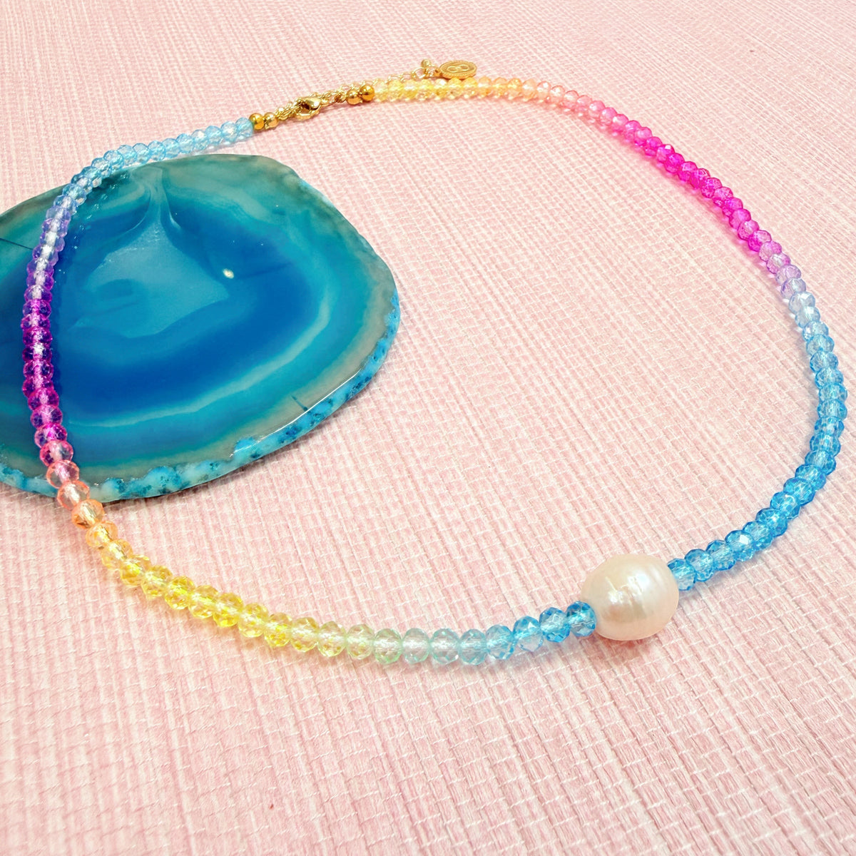 Rainbow Splenda beaded necklace with a white pearl center