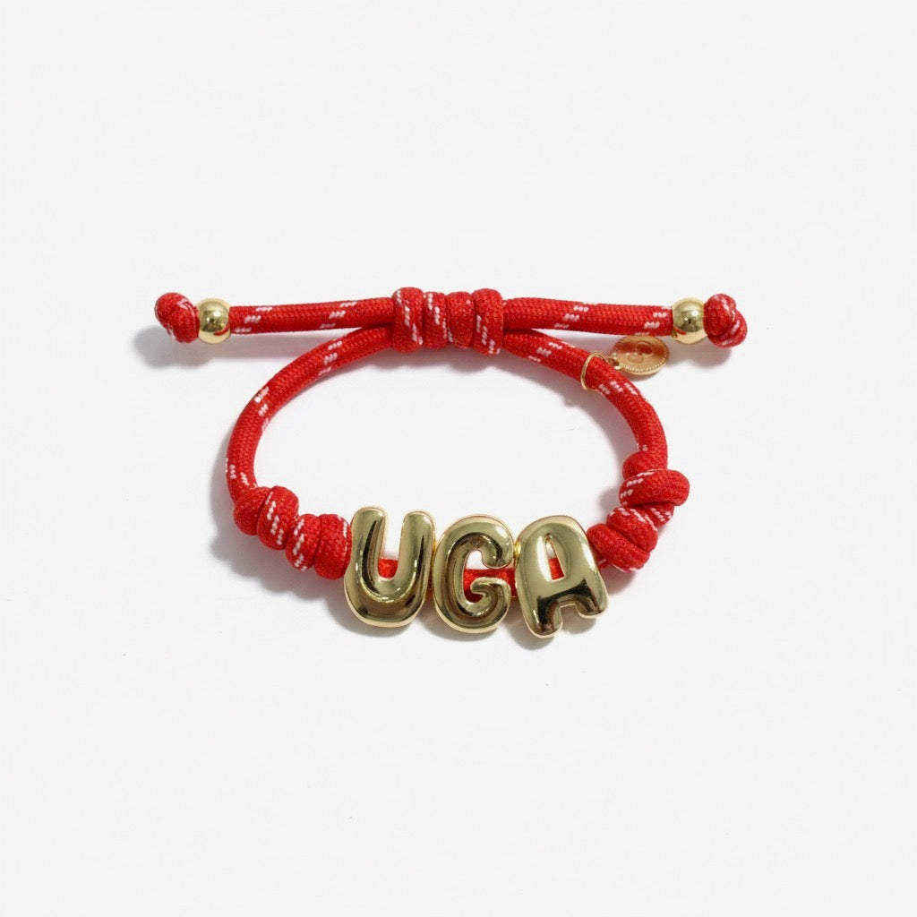 Red paracord bracelet with gold UGA letters