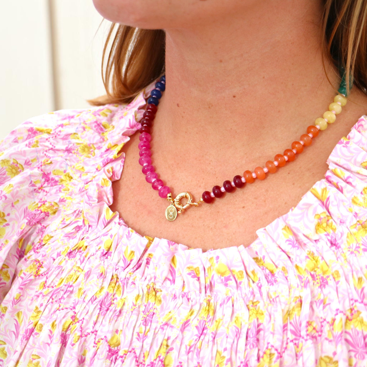 Woman wearing the Cannes rainbow beaded necklace