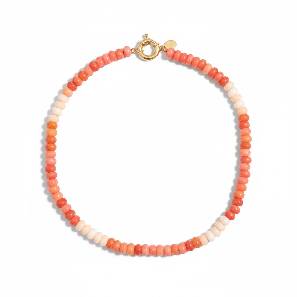 Gresham Amalfi orange beaded necklace made with dyed jade stones and 18k gold-filled findings on a white background.