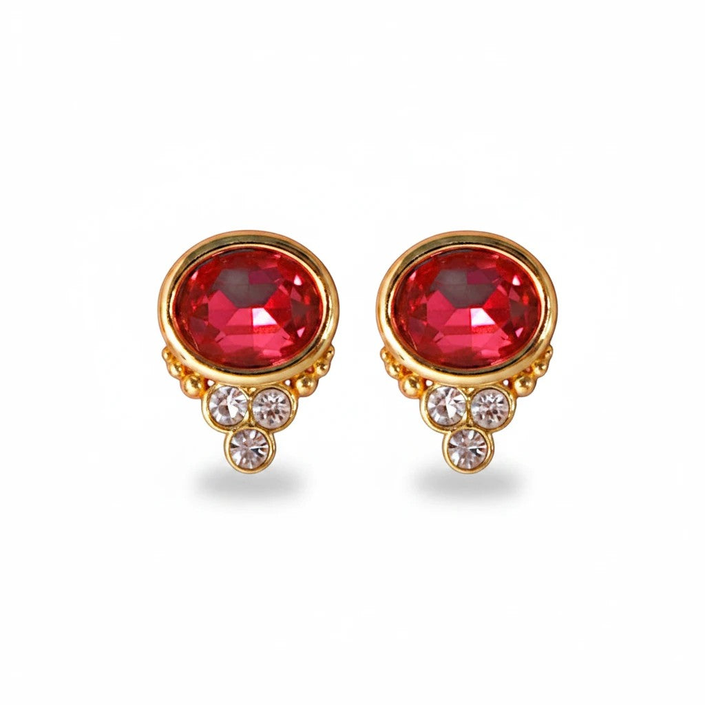 Gresham BonBon ruby oval stud earrings with gold setting and small clear crystal accents.