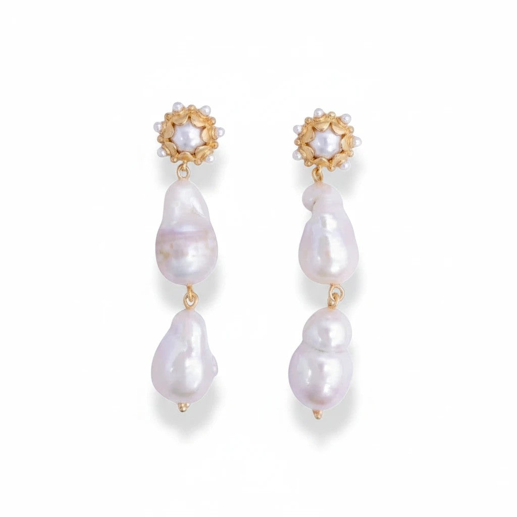 Gresham Clio medium drop earrings featuring organic freshwater baroque pearls and gold floral stud accents.