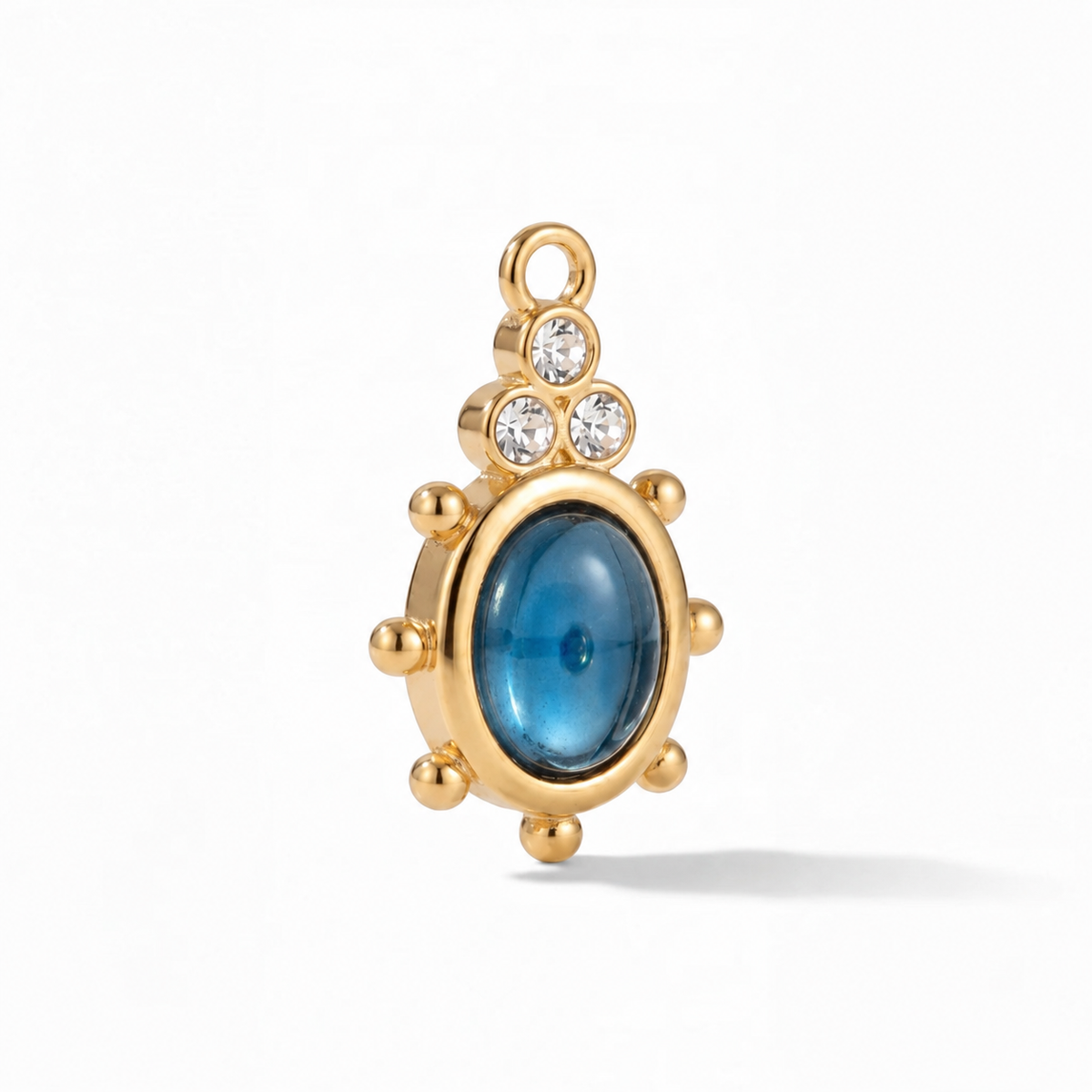 Cupola Sapphire Charm in gold, shown at a three-quarter angle on white.