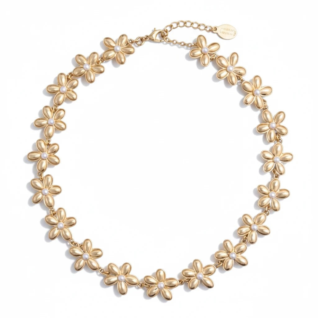 Gresham Flora necklace featuring gold-tone metal flower charms with small white pearl centers on a delicate chain.