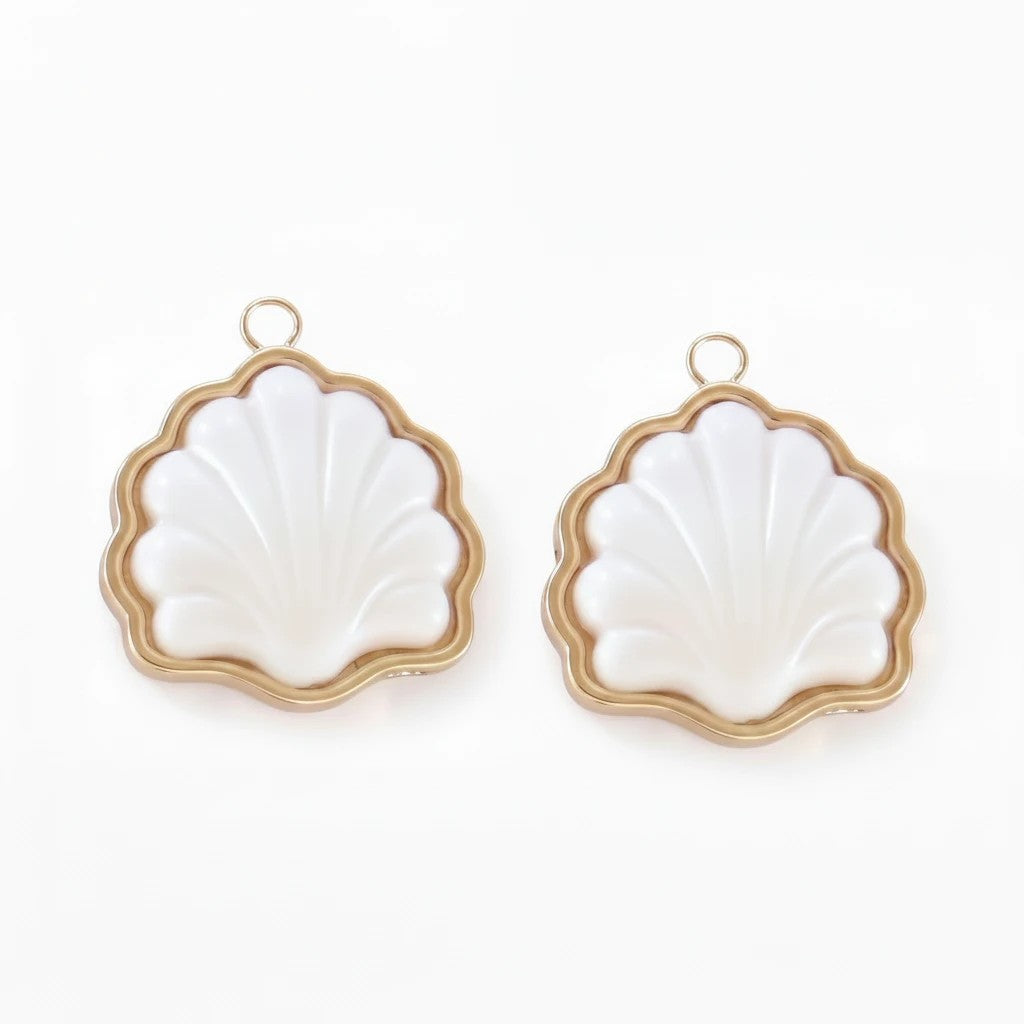 Gresham Fountain Shell Charm Pair featuring white shell accents in gold-toned settings for hoop earrings.