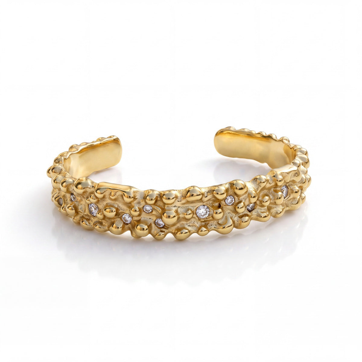Gresham gold-tone open cuff ring with molten-inspired texture and embedded clear pavé stones