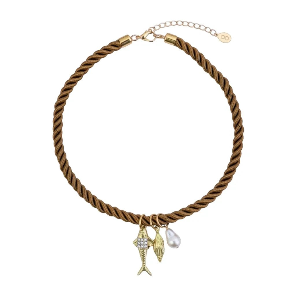 Gresham Jingle necklace featuring a twisted brown silk rope with gold-plated fish, shell, and pearl charms.