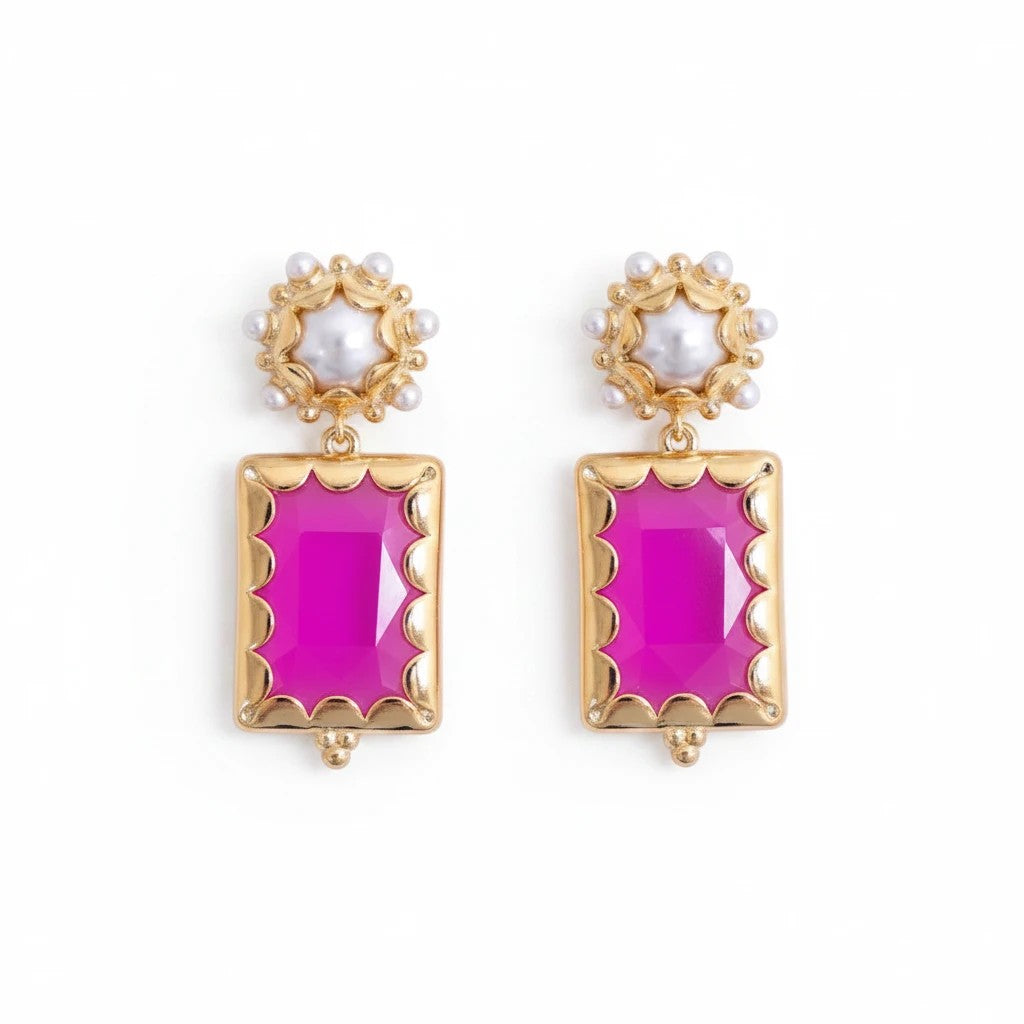 Gresham Mini Gemma earrings featuring rectangular Barbie pink stones in gold settings with pearl accents.