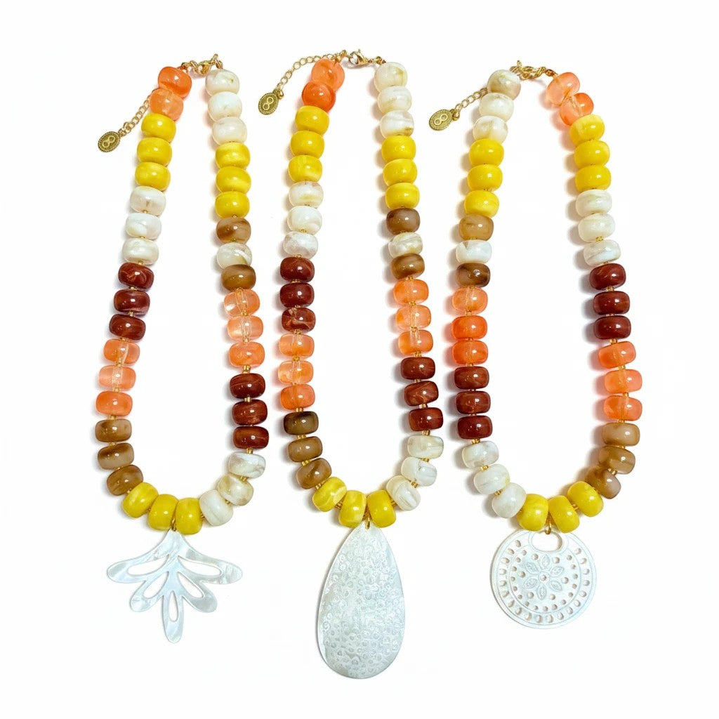 Gresham Nardo Sunset necklaces featuring colorful resin beads and unique mother-of-pearl pendants on white background.