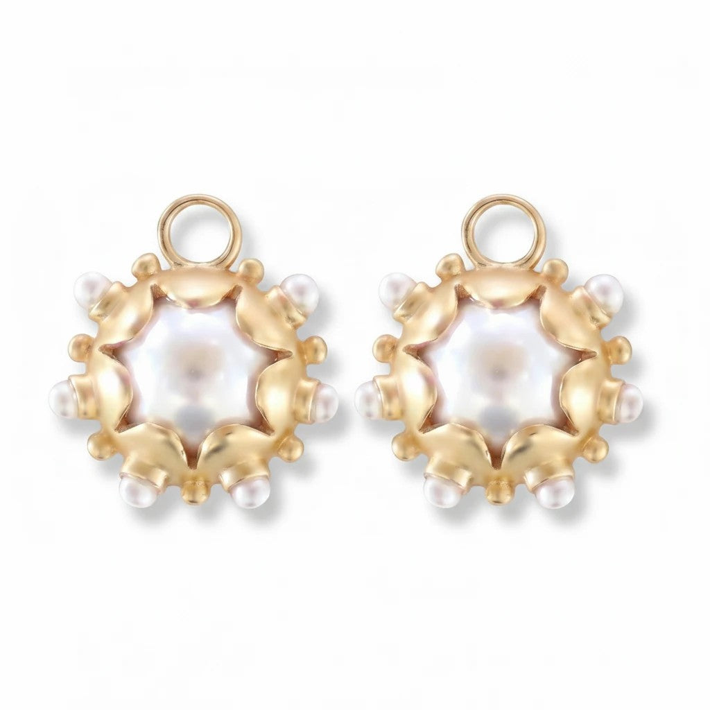 Gresham Perla Charm Pair featuring gold floral settings with central white pearls and small pearl accents.