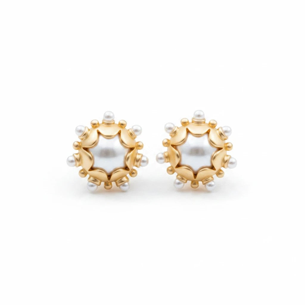 Gresham Perla Studs featuring 18k gold plated scalloped bezels with white pearl accents in a Renaissance style.