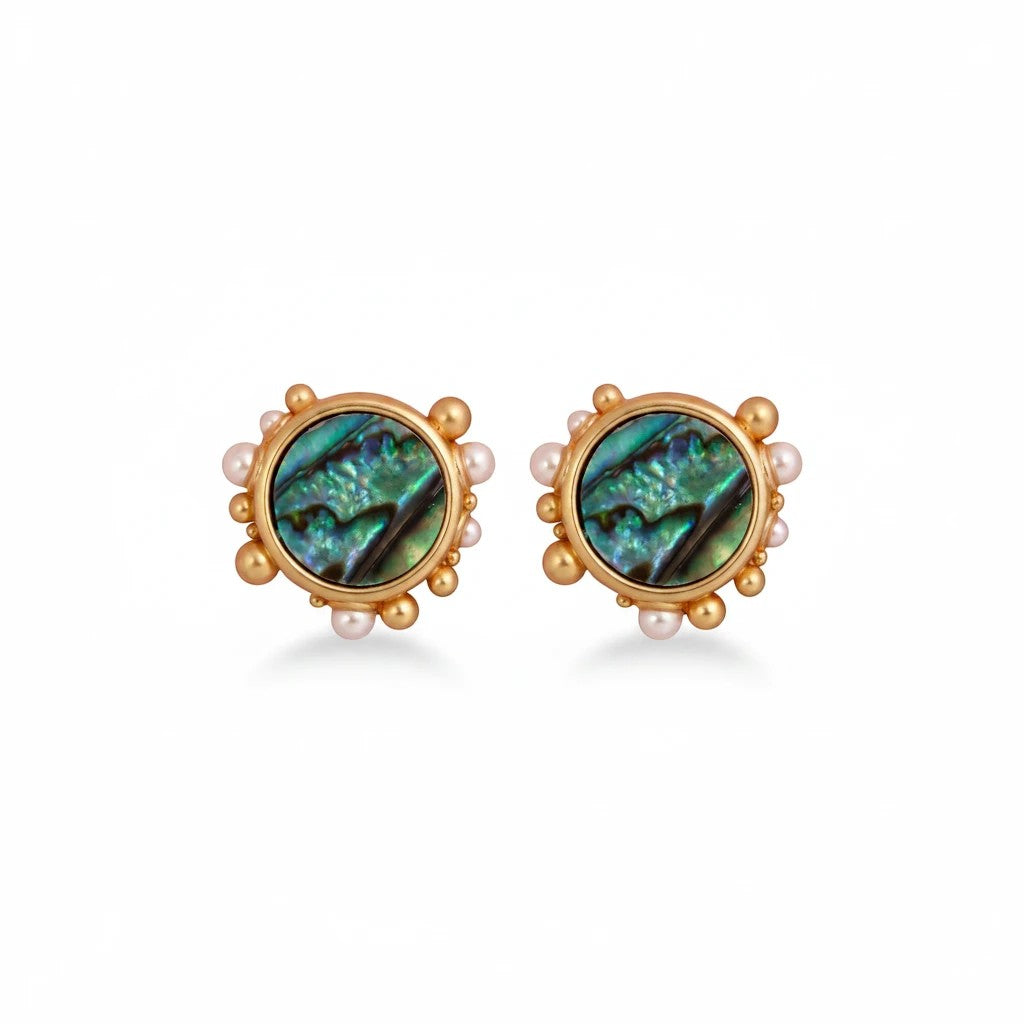 Gresham Porto stud earrings featuring round abalone shells framed by gold and pearl granules in a seashell design.