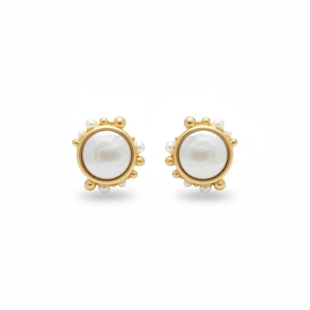 Gresham Porto Studs featuring freshwater coin pearls framed by gold and pearl granules in a seashell-inspired design.