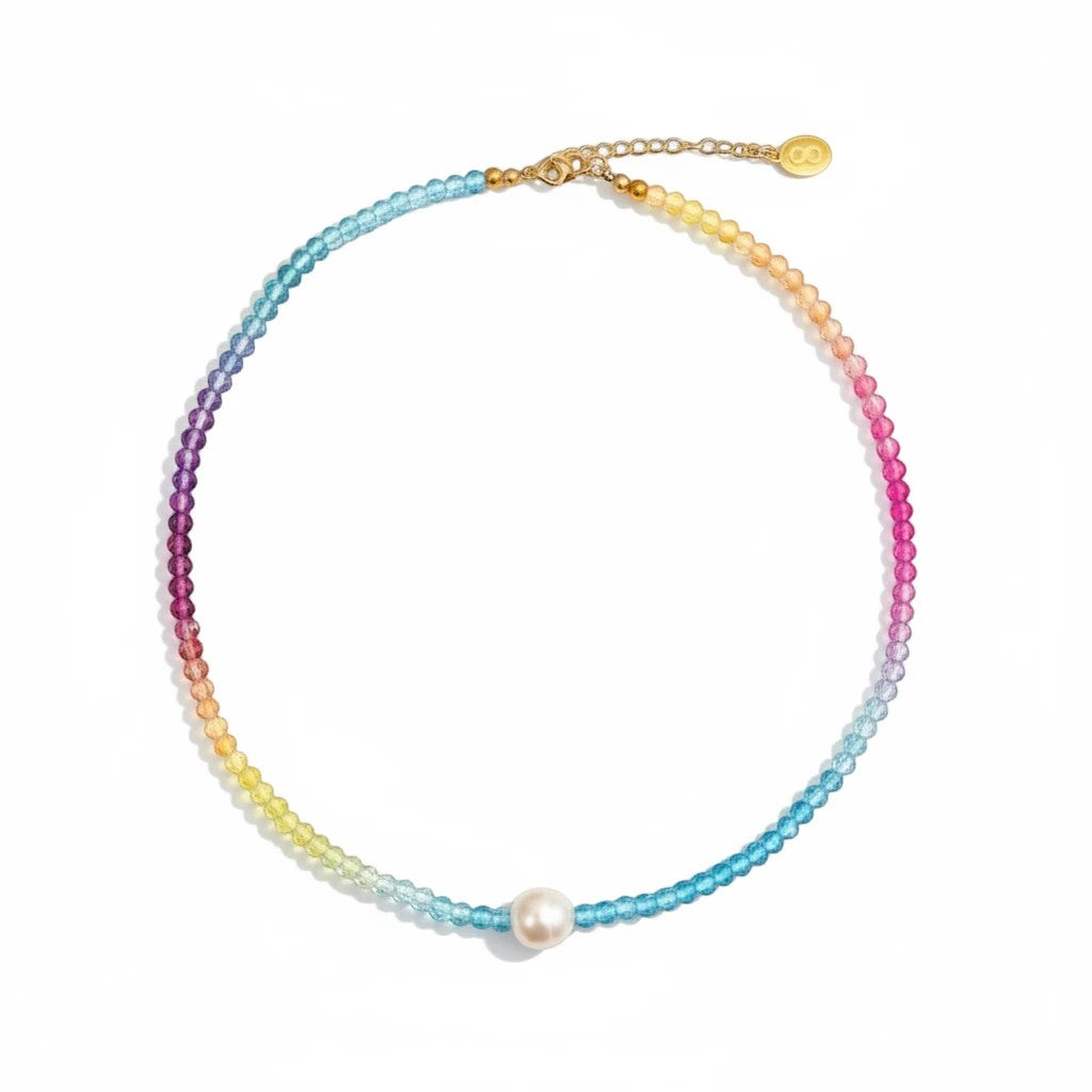 Gresham Splenda necklace featuring a rainbow crystal bead strand with a central white freshwater pearl.