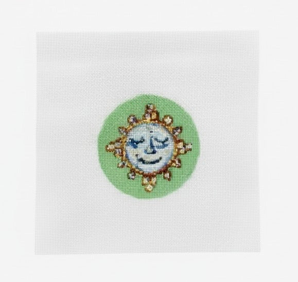 Luna man in the moon needlepoint design on a green circle