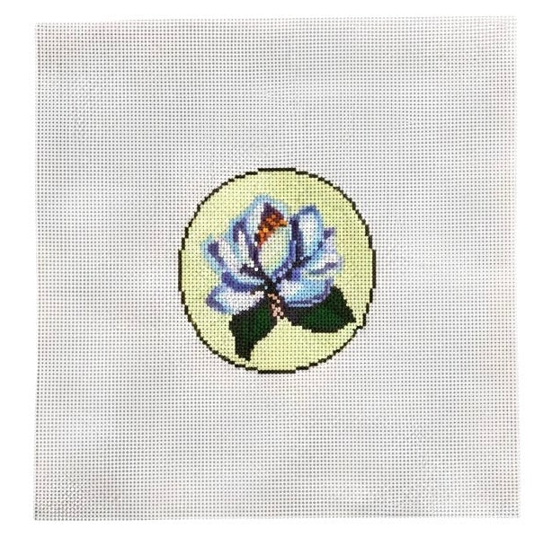 Magnolia flower needlepoint design on a pale yellow circle
