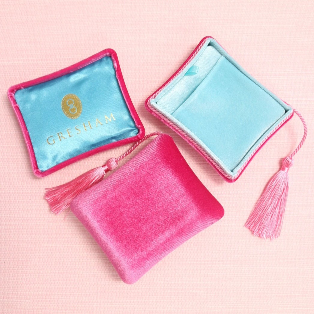 Pink and aqua travel jewelry storage boxes